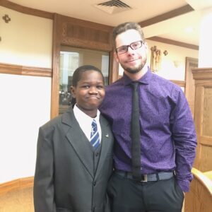 A young boy and his adult match.